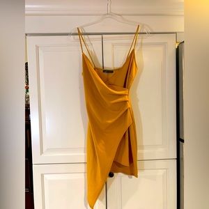 Cute gold mini dress! Ruched is very flattering! Beautiful color.